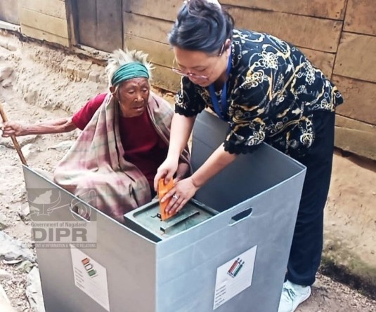 A senior citizen casting vote through Postal Ballot by the Absentee Voters for the 18th Lok Sabha election in Phek district on April 12. (DIPR Photo)